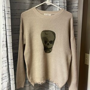 Tan sweater with camo skull